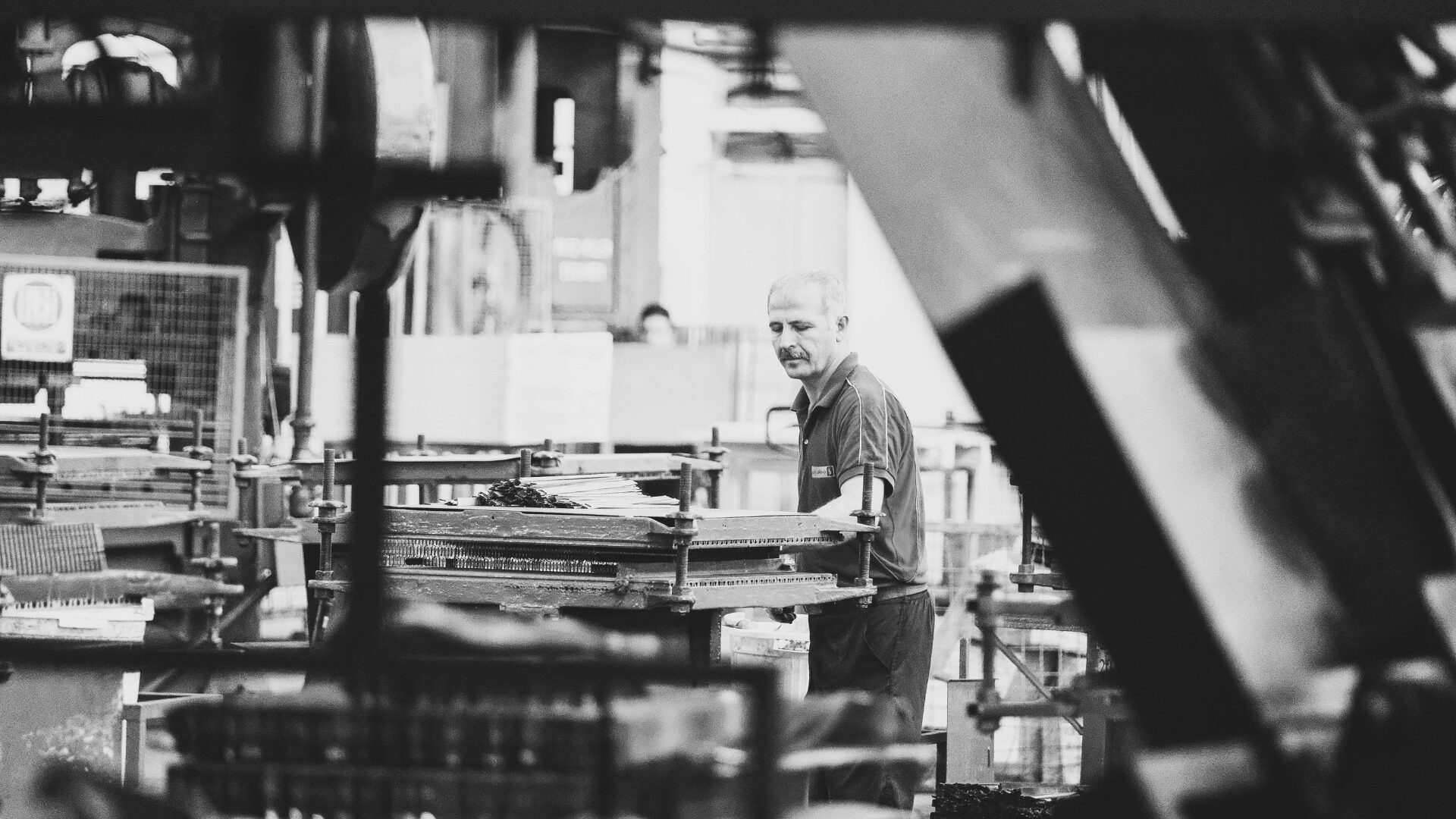 Factory worker practicing lean manufacturing principles on the manufacturing shop floor